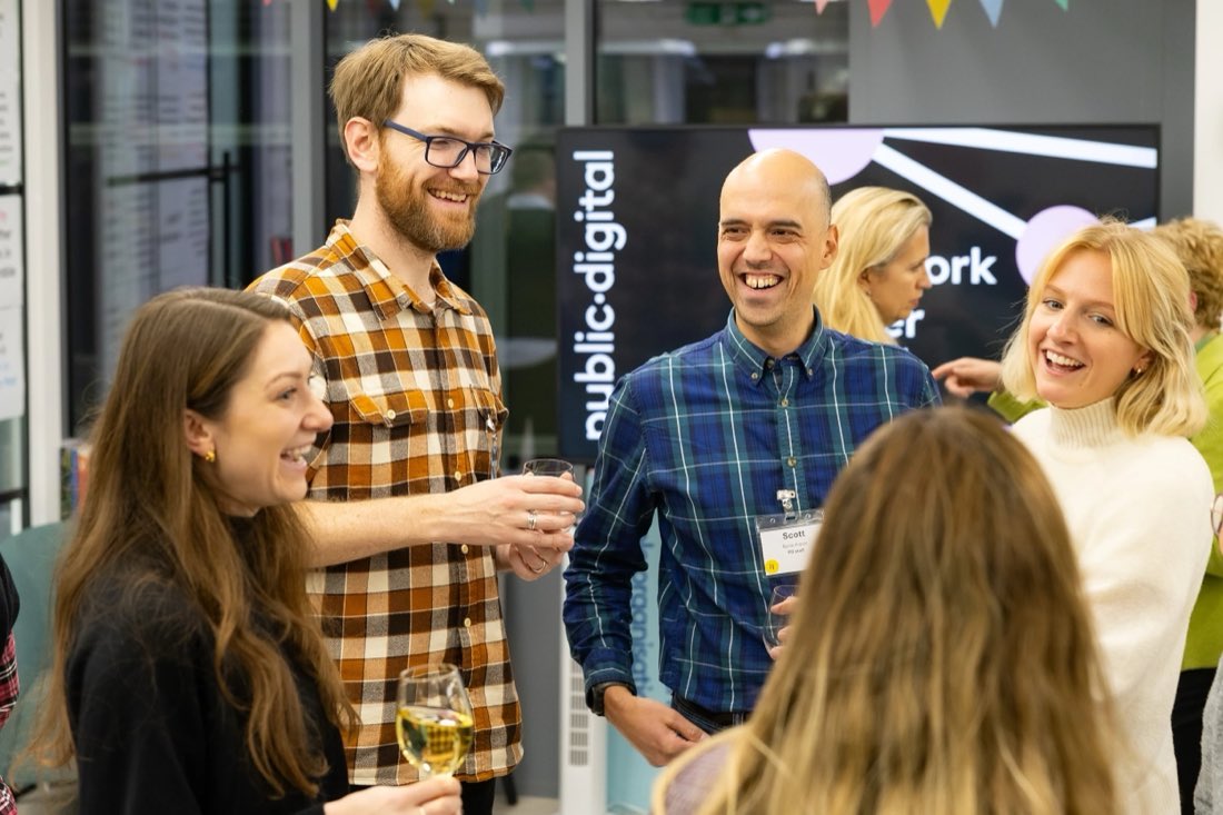 Scott talking with people at a network mixer